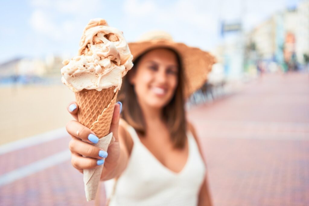 person holding ice cream cone